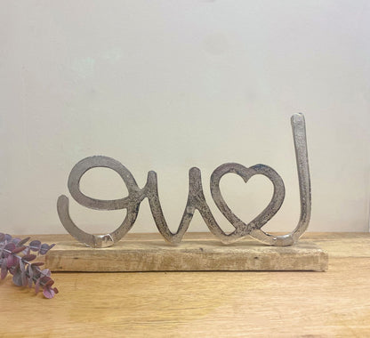 Metal Silver Love Ornament On A Wooden Base